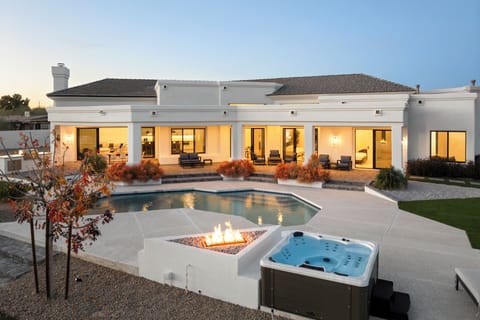 Private resort vibes: Hot tub, pool, and fire pit in the desert. 