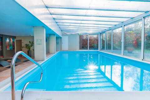 Dive into a sunlit indoor pool for year-round relaxation