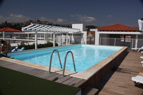 Lounge around the on-site outdoor pool.