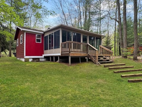Rear of the cabin- screened porch leading down to the waterfront age. 
