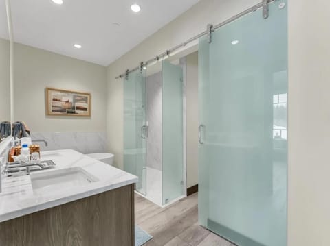 Modern bathroom retreat with sleek glass shower doors