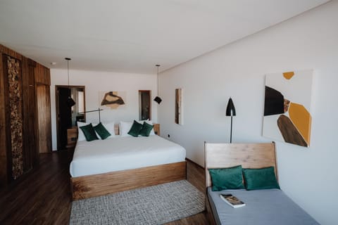 Settle into crisp linens and warm wood design details