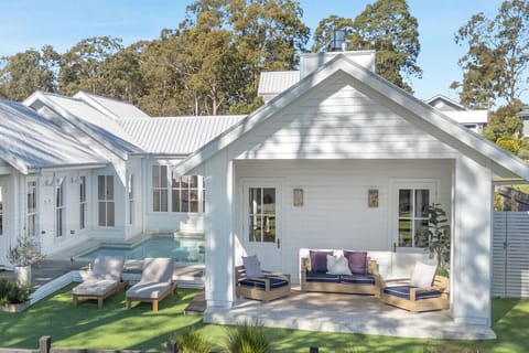 Four bedrooms, three bathrooms, two separate living spaces and multiple outdoor living areas. BBQ, outdoor dining and lounge areas, seasonally heated pool — designed for weddings, groups and family stays. Pet friendly.