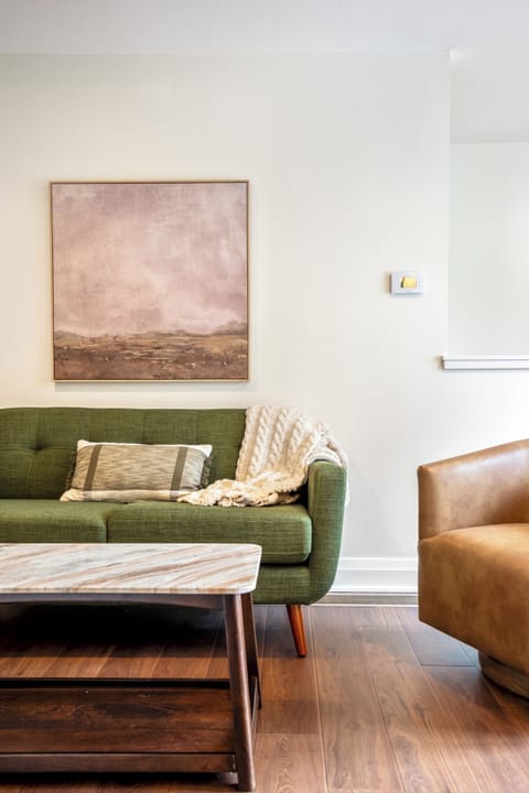 Comfortable living room area with a cozy couch and chairs—perfect for relaxing.