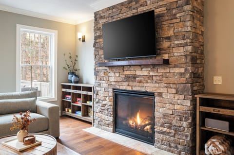 Cozy up by the fireplace on our custom Crate & Barrel sectional
