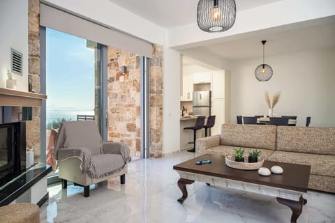 Bright and comfortable living room with sea views, natural light, and easy access to the terrace, creating a relaxing space.