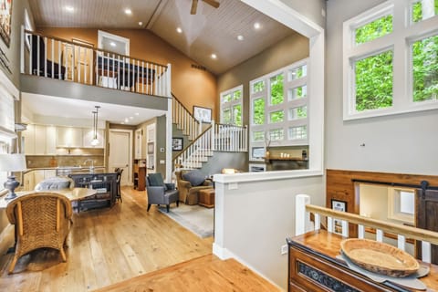 Kick back in this cozy living room with forest views