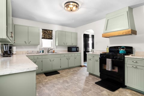 Fully equipped kitchen with plenty of storage and cooking essentials.