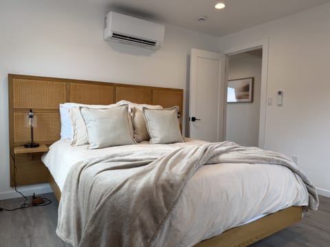 Bedroom Retreat: Relax in style with plush bedding and chic decor in this serene getaway!