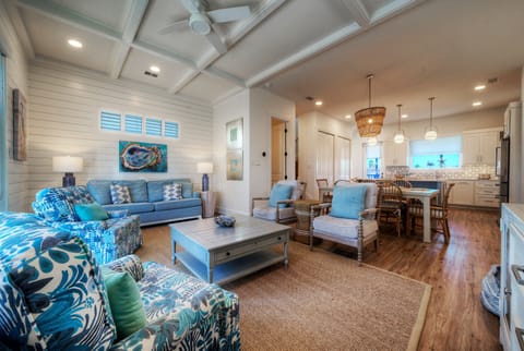 Open-concept living area with comfortable seating and a view toward the dining space. (Southern Cross)