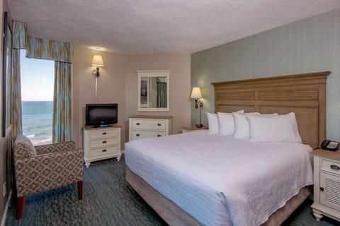 Sink into a plush king bed after a beach day.