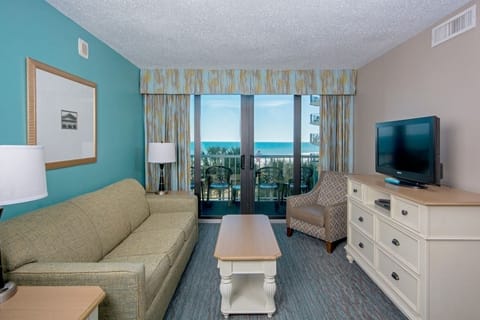 Lounge together and drift into beach mode by the windows.