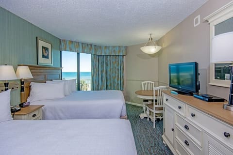 Drift off after beach days in bright, airy comfort.