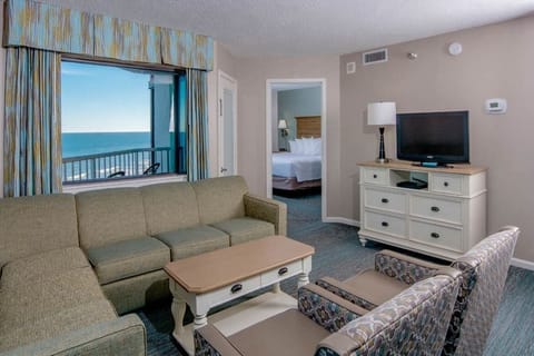 Gather for movies and sunsets in this cozy living area.