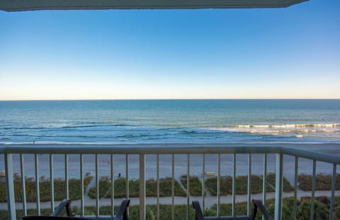 Savor sunrise coffee with endless ocean views below.