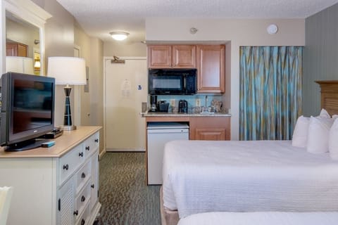 Recharge in cozy beds steps from your handy kitchenette.