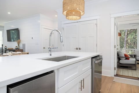 CENTER ISLAND FOR GREAT COOKING SPACE.  OPEN KITCHEN TO BACK PORCH