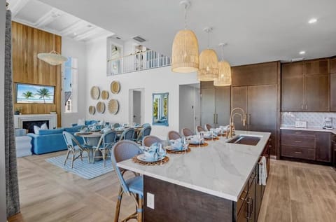 Your open-concept kitchen and living space flows seamlessly together, where you'll love preparing meals at the marble island while friends gather around.