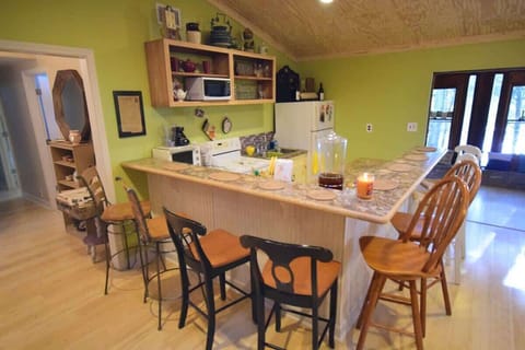 Eclectic dining area w/ colorful accents & cozy counter seating