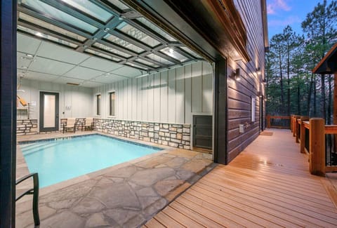 Your own private indoor pool house with direct access to the deck and forest views.