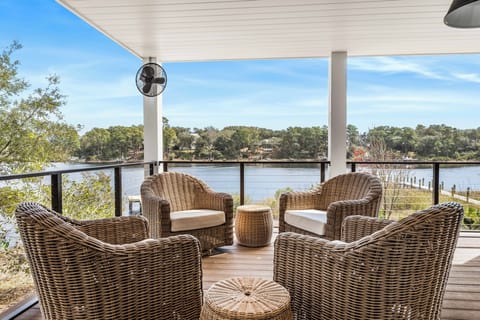 Picture yourself here: wine in hand, book open, and a perfect lake view