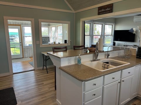 Kitchen & dining featuring vaulted ceiling & ceiling fan