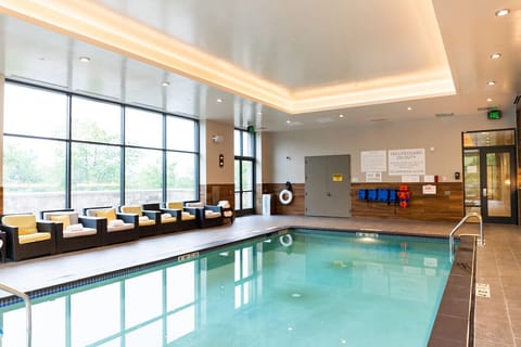 Float in a sunlit indoor pool after a busy day.