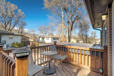 Blue-sky mornings on the raised deck—grab a seat at the bistro table, fire up the grill, and watch the neighborhood beyond the wood railings and bare trees.