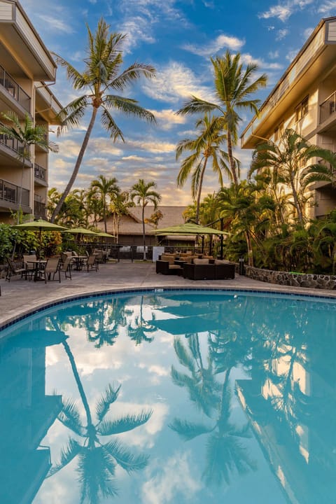 Seating area with a tropical setting by the pool at the time share complex