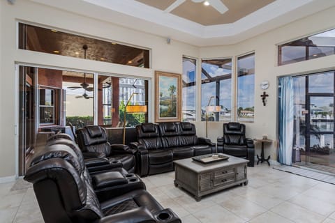 Sink into luxurious leather recliners in your spacious living area, where you can unwind while enjoying views of the surrounding area through expansive windows.