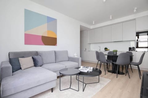 Relax in the stylish living room with a comfortable sofa and modern decor.
