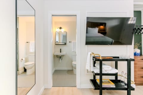 Freshen up easily with a convenient sink area and essentials.
