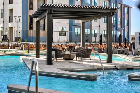 Pool area with pergola and lounge seating