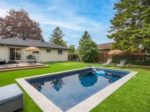 Refreshing inground salt water pool and sun seck area, perfect for summer relaxation in Ottawa