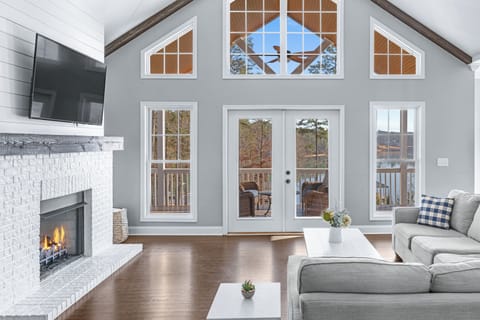 Living room with fireplace and lake view