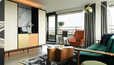 Lounge by expansive windows and soak up leafy views.