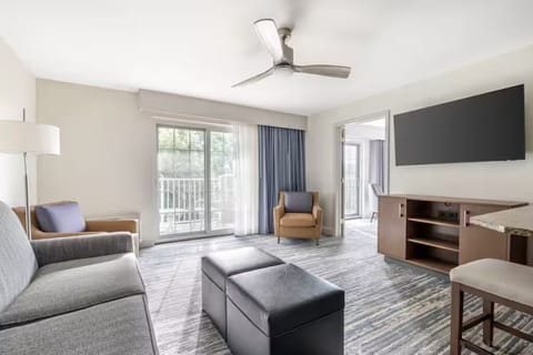 Unwind in a sunlit lounge steps from the balcony.