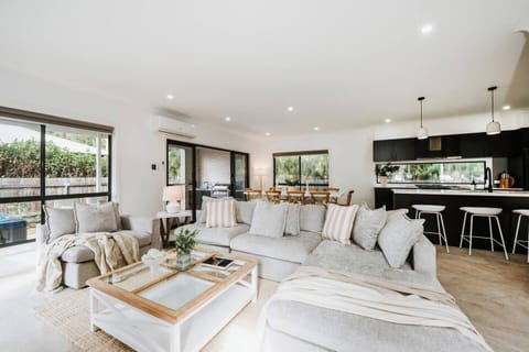 The open layout connects living, dining and kitchen spaces, making it easy for everyone to gather, cook and spend time together.