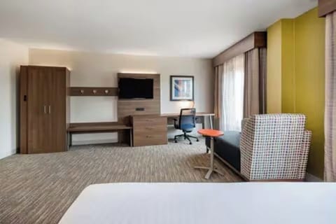 Stretch out on a serene king bed after busy days.