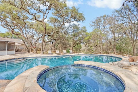 Pool and hot tub nestled among mature oak trees create a private oasis for your perfect retreat.