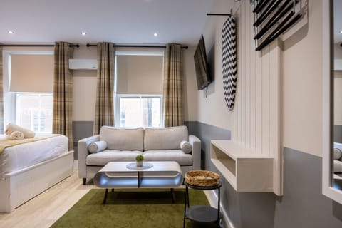 Studio for 4 guests, 2 adults and 2 children, with street view