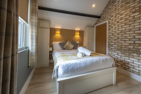 Charming beamed ceiling complements stylish decor perfectly