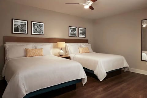 Settle into crisp linens with two queen beds for easy comfort.