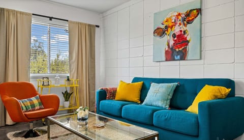 Sunlight, bold colors, and a chair that demands a spin.