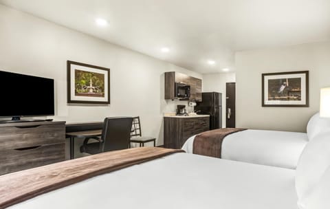 Settle in with cozy bedding and an easy in-room kitchenette.