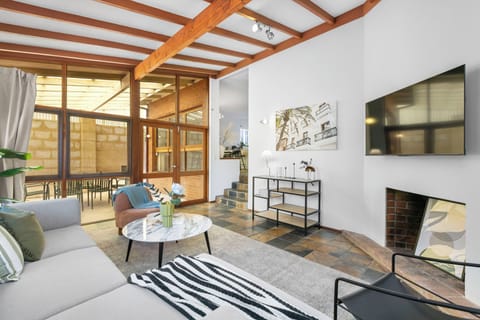 Enjoy the seamless transition from indoor lounging to the private outdoor terrace—perfect for a morning coffee or an evening glass of wine.