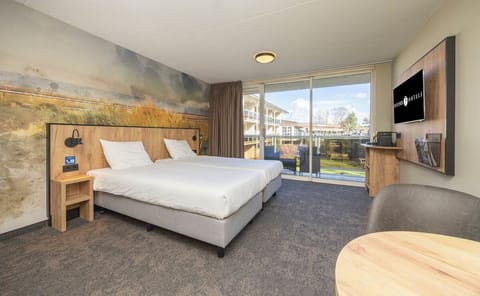 Wake up to balcony views and a sunlit, airy suite.