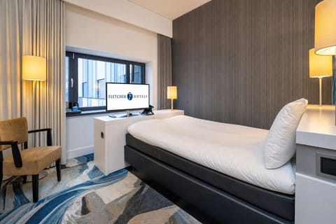 Relax into a peaceful night with warm lamps and plush bedding.
