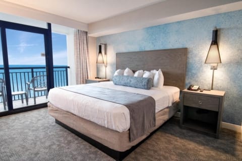 Unwind in a plush king bed with ocean views.