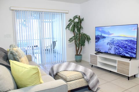 The living room and dining area are fully integrated into the kitchen